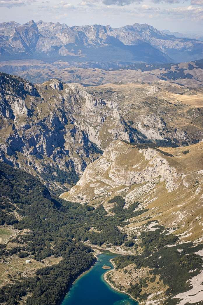 Views of a mountain lake and surrounding mountains