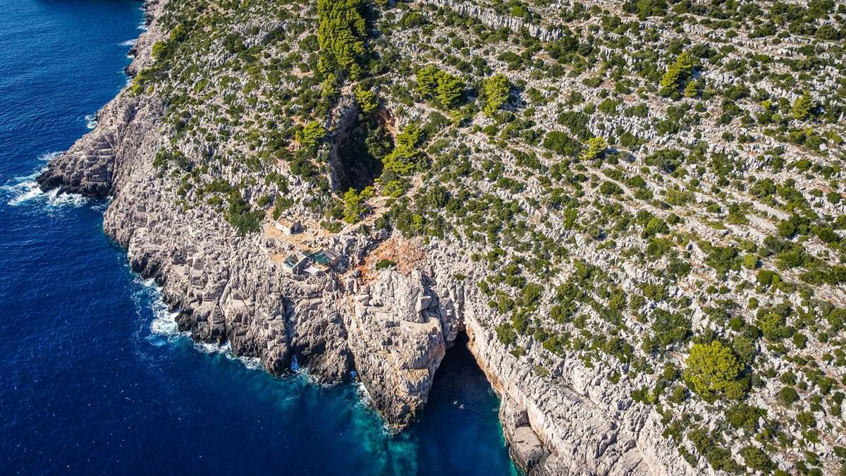 A cave on the coast from above