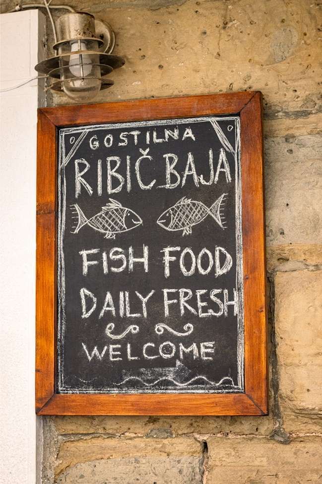 A restaurant sign advertising fresh fish