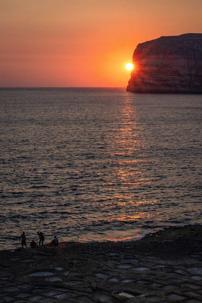 Watching the sunset from Xlendi in Gozo, Malta.